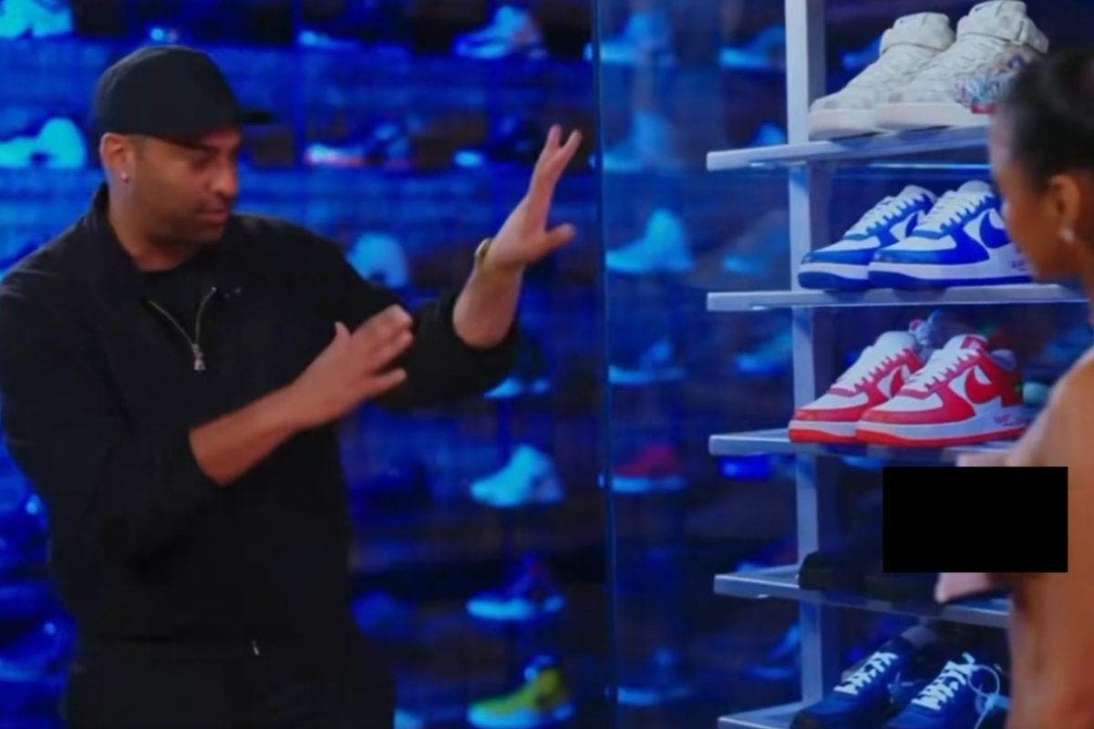 Tyla sneaker shopping outfit leaves little covered beyond a strategically placed piece of paper