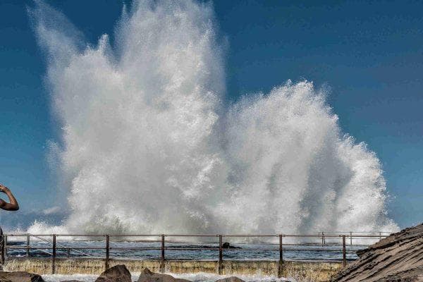 California officials warn residents to be extremely careful as 16-foot waves hit the coast
