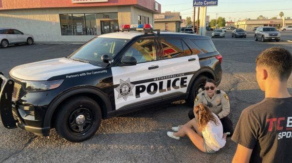 Las Vegas teen was enjoying a relaxing walk when he suddenly spotted a cop-suspect scuffle and stepped in