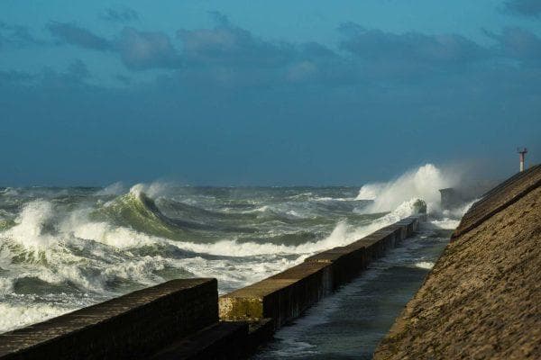 Terrifying moment massive waves slam into moving Amtrak train in California